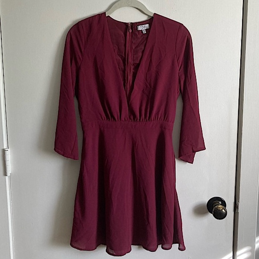 Tobi burgundy dress with long sheer sleeves and low neckline COLOR OF the SEASON